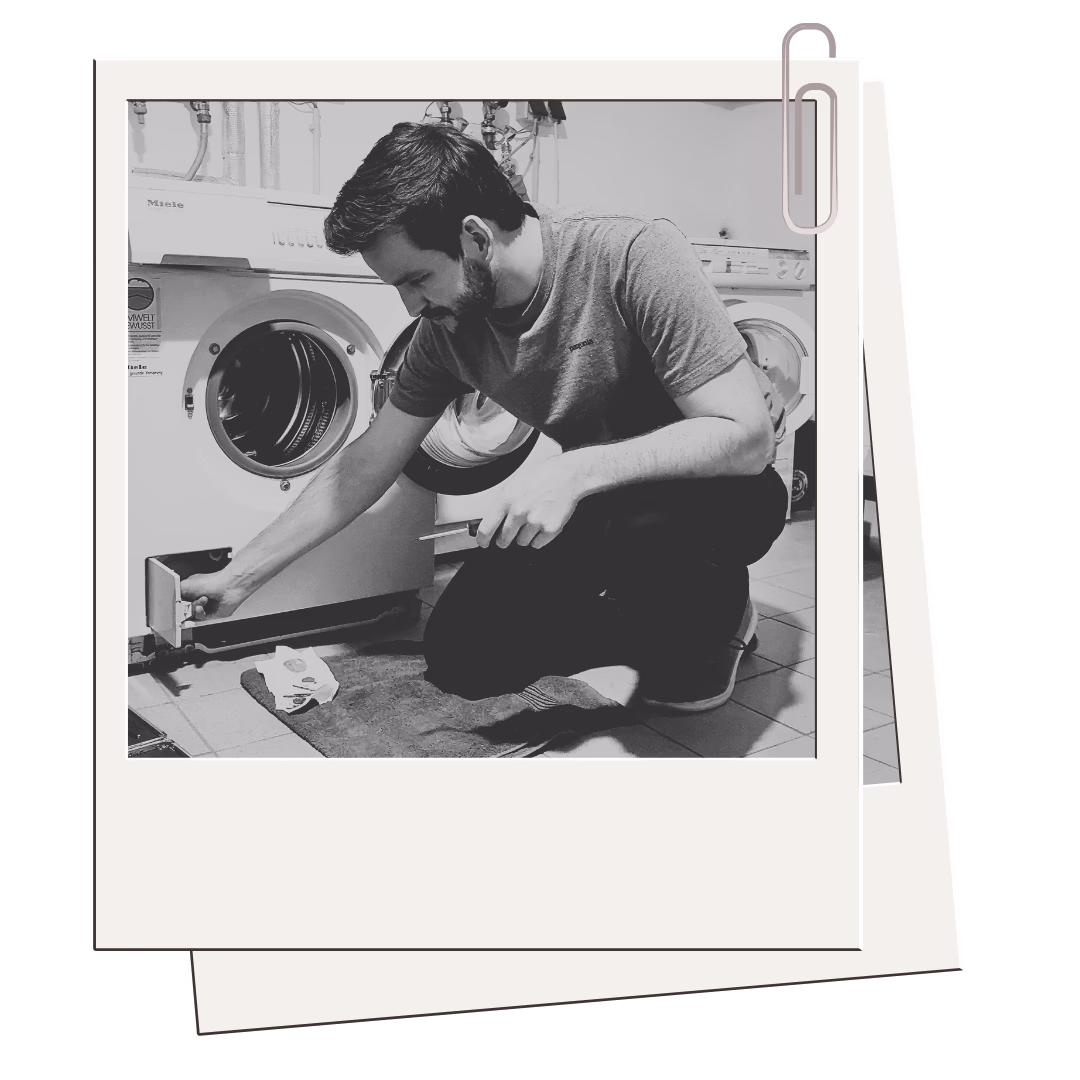 FixFirst co-founder Sebastian repairing a washing machine