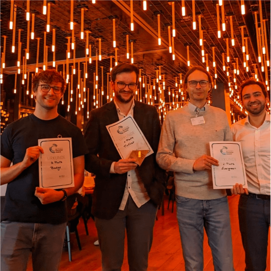 FixFirst team holding their Sustainable Rockstar Award certificate