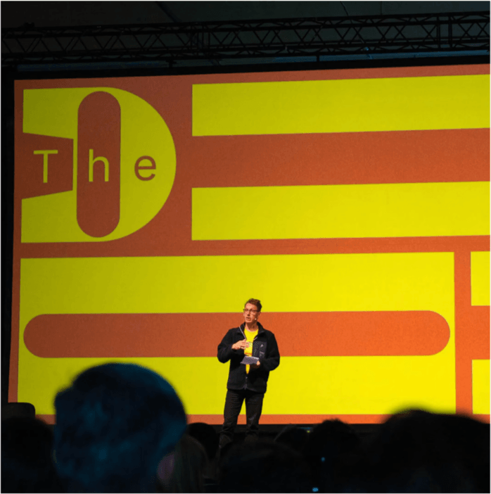 FixFirst founder speaking on stage at TheDrop50